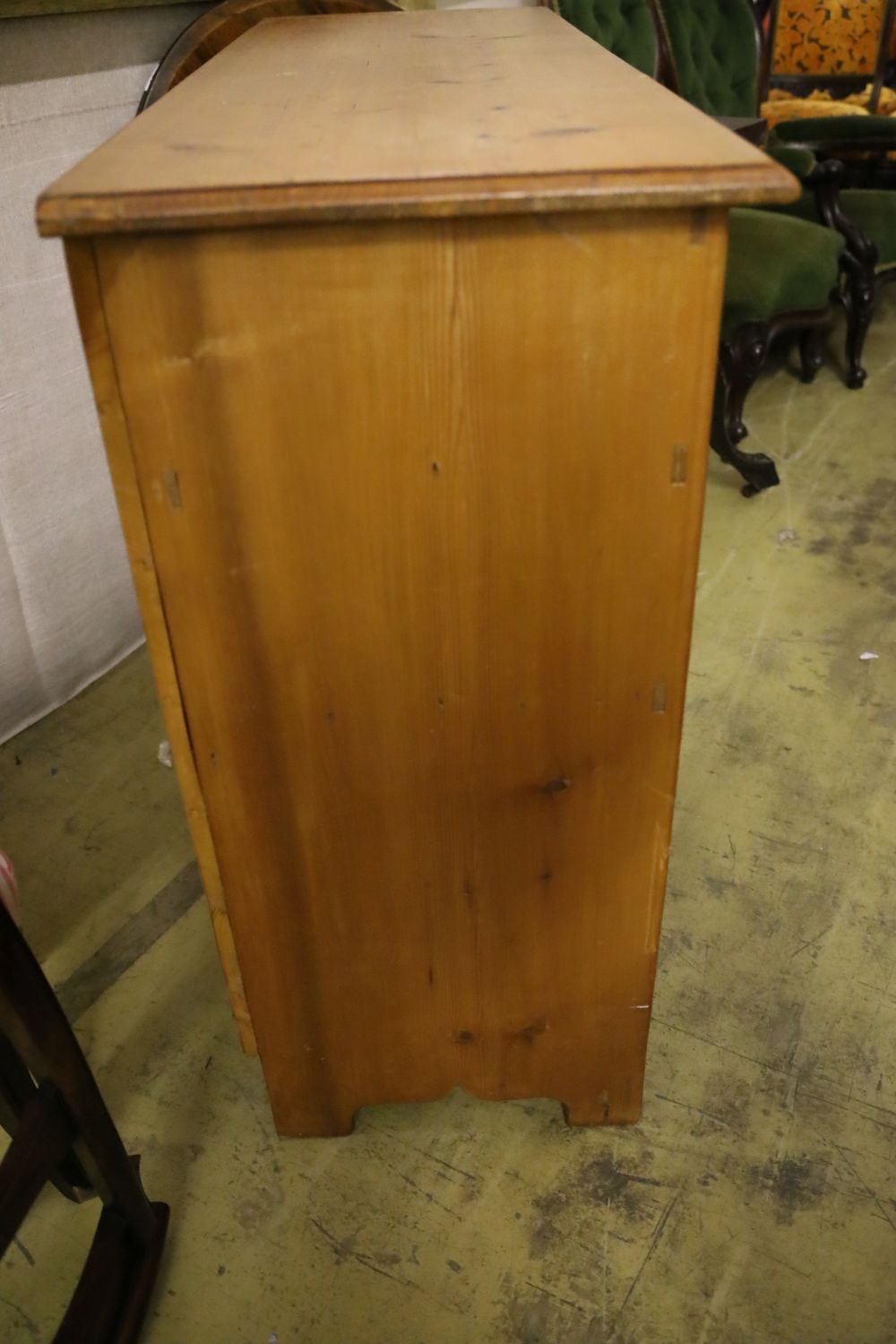 A pine five drawer side cabinet, width 117cm depth 40cm height 87cm